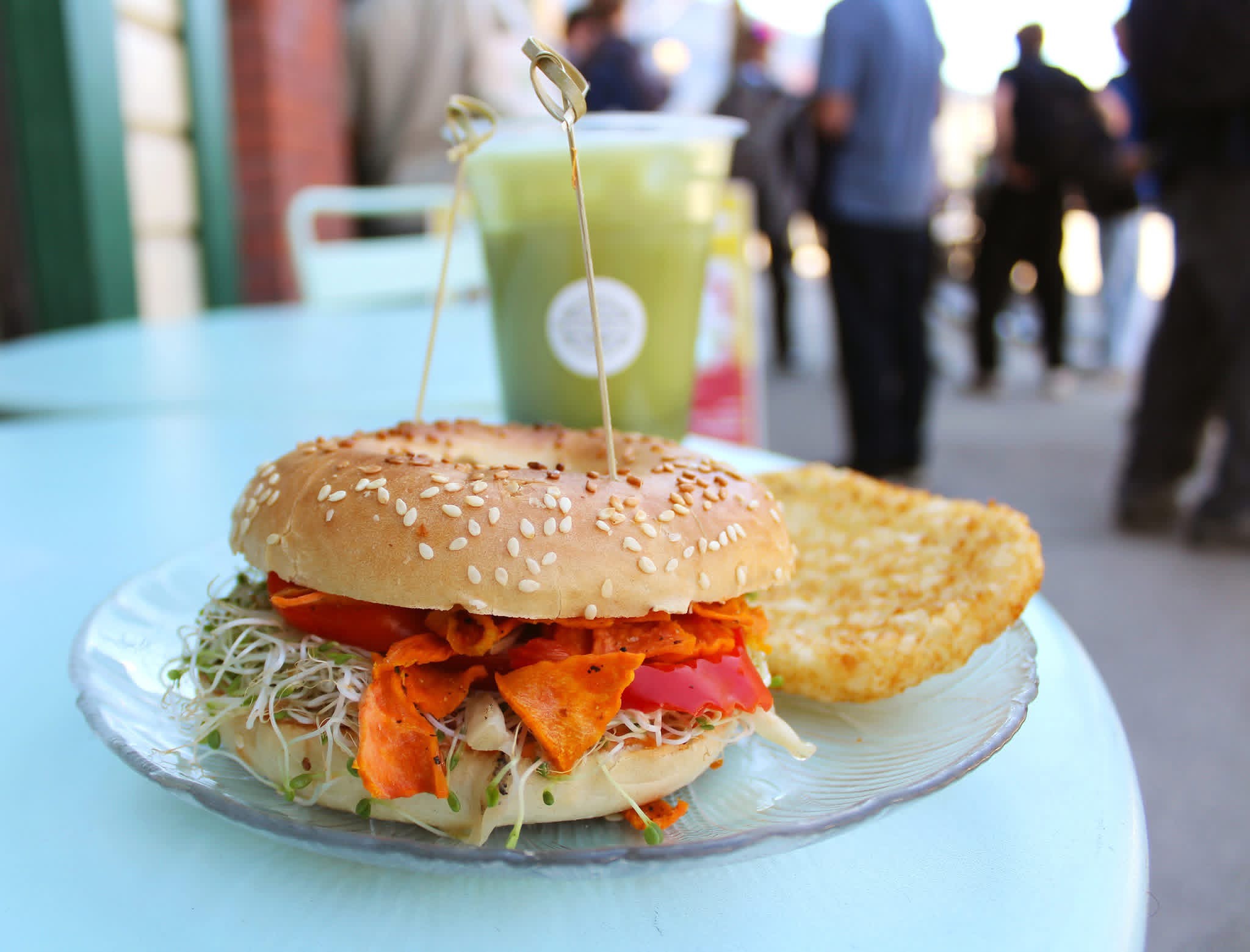 Carrot lox bagel with green drink